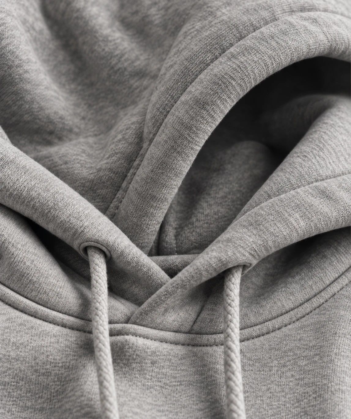 Close-up of a grey fleece hoodie with drawstrings